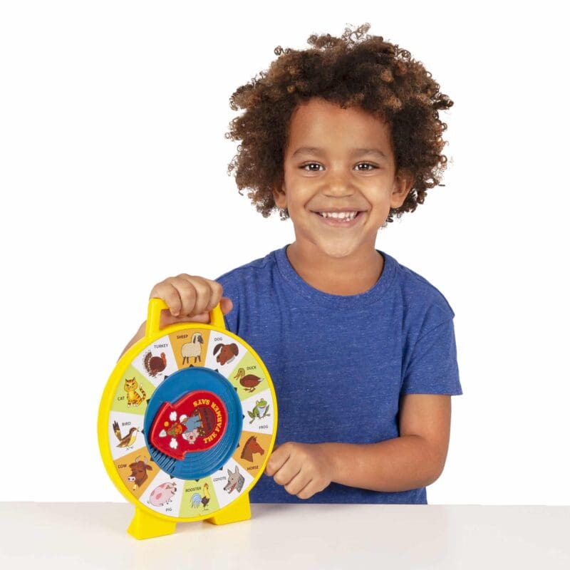 2070-Fisher-Price-See-N-Say-Lifestyle3-web Lifestyle shot of boy holding the Fisher-Price See N Say